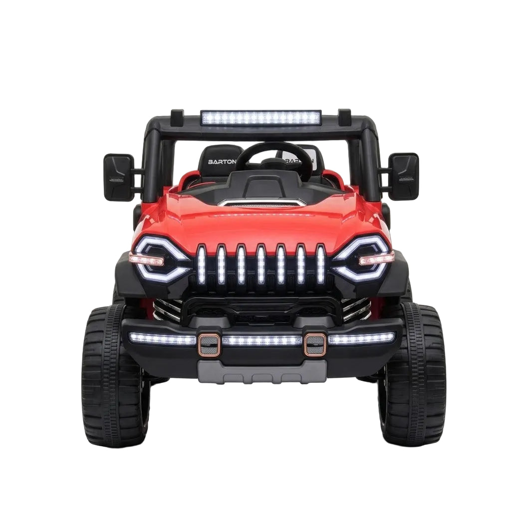 A red and black toy Jeep-style off-road vehicle with large black tires, a light bar on the roof, and illuminated LED-style headlights and front bumper lights, shown from the front on a white background.