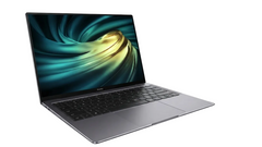 A silver-gray laptop shown open at an angle against a plain white background, with a colorful swirling display on the screen.