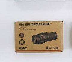 Four boxes containing rifle scope with laser sight and high power flashlights on a white background