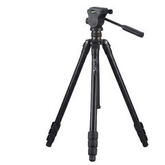 Two black camera tripods photographed on a clean light gray studio background. The tripod on the left is fully extended with a handguard and leg knobs visible, and the tripod on the right is partially folded.