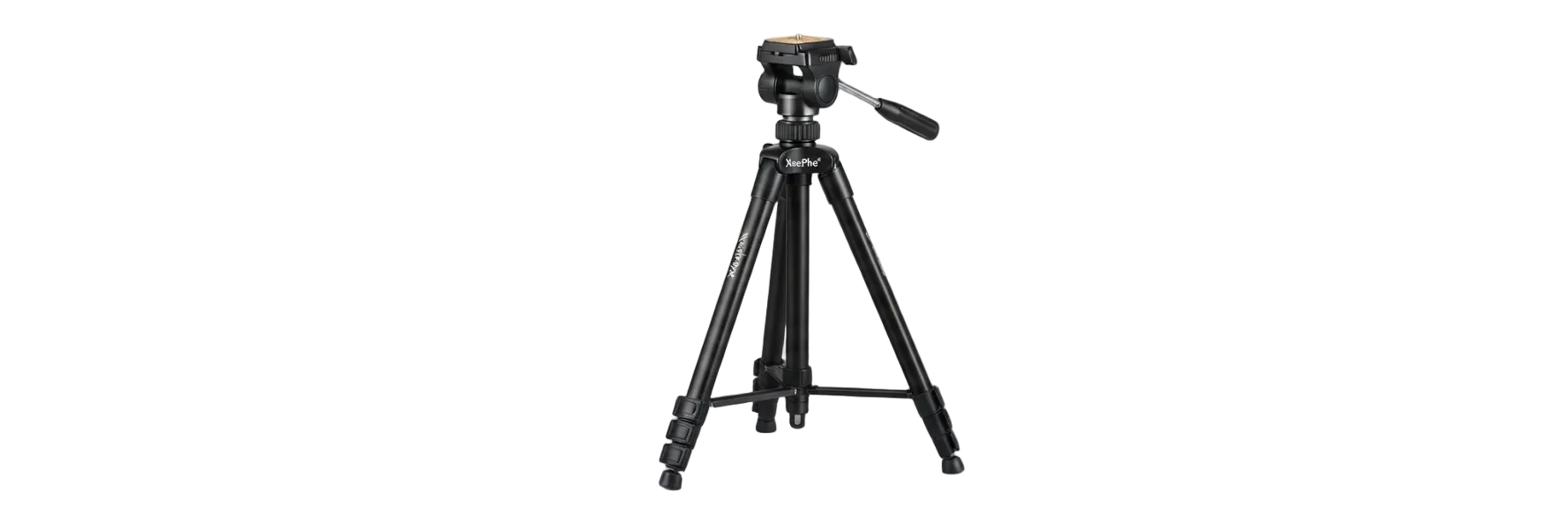 A black tripod with a mounted camera head and handle, standing on a gray surface against a misty white background.