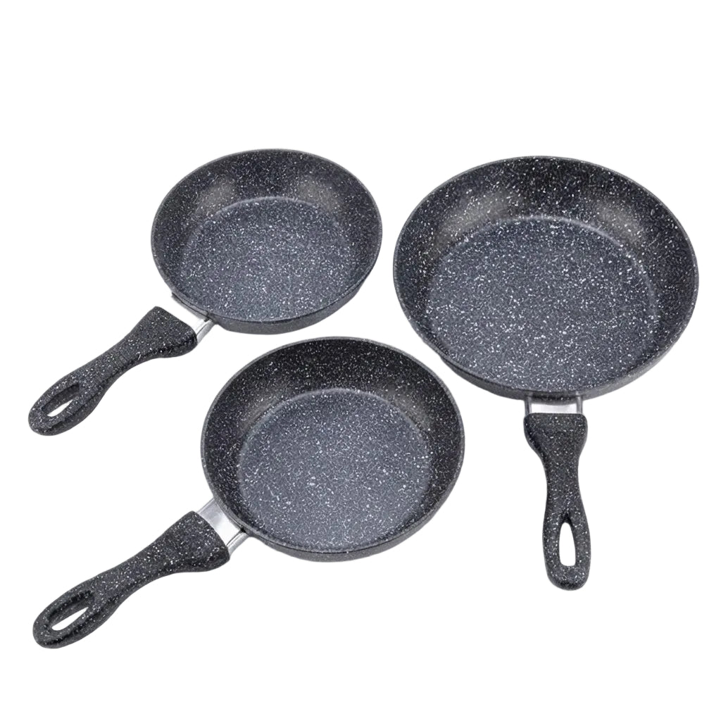 Three non-stick frying pans with black speckled interiors and black handles, arranged on a plain white background.