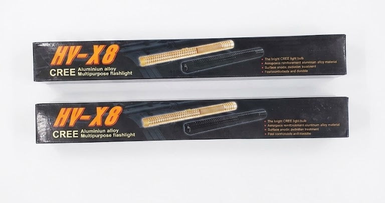 Two HV-X8 Cree LED flashlight packages on a white background with product details.